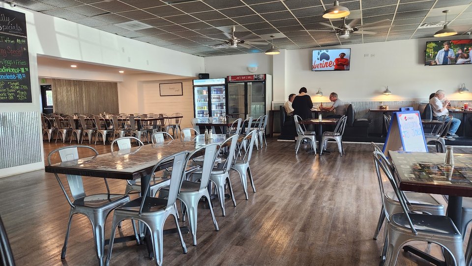 Casual bar seating with tables and stools.